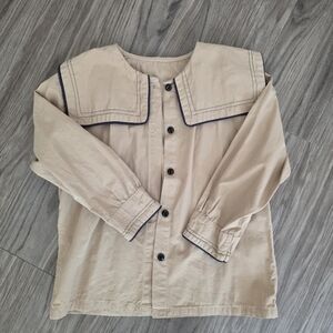 Beige Button-Up Shirt with Black Trim